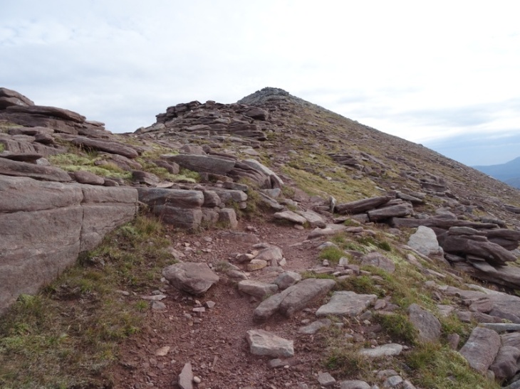 Heading up to the Sail Garbh summit. See the change from pink sandstone to grey quartzite?
