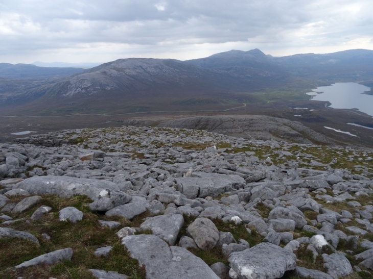 Boulder field and quartzite pavement down the expansive, wide flank of Spidean Conich (looking east).