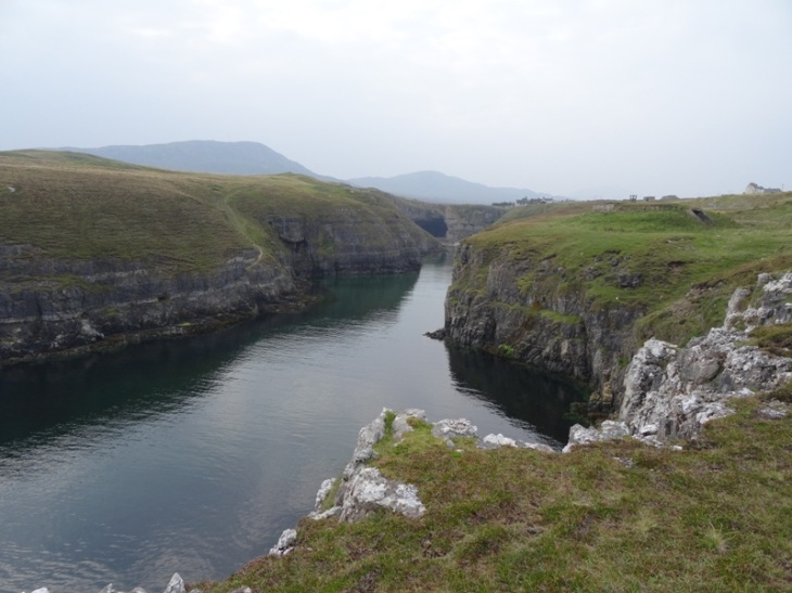 Looking back at Smoo Cave from the end of the inlet. Tide is in.